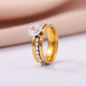 Elegant Gold Solitaire Ring with Channel-Set Crystal Stones